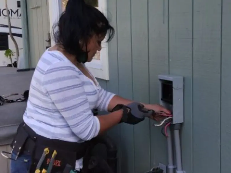 Licensed electrician wiring an exterior subpanel in Potter