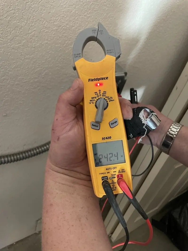 Voltage testing with clamp meter during Whole House Surge Protector in Potter